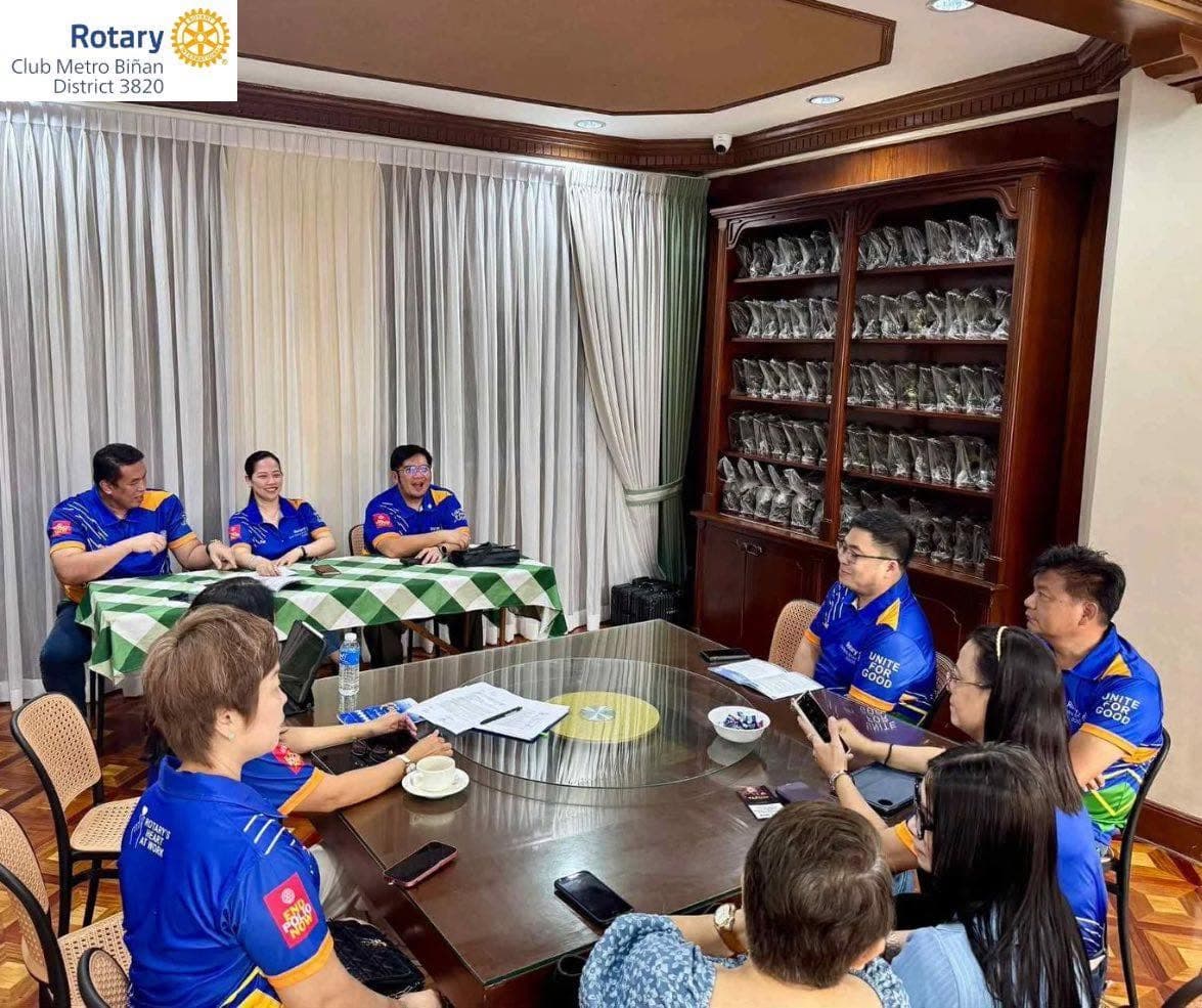Rotary Club of Metro Biñan officers and members at a club meeting
